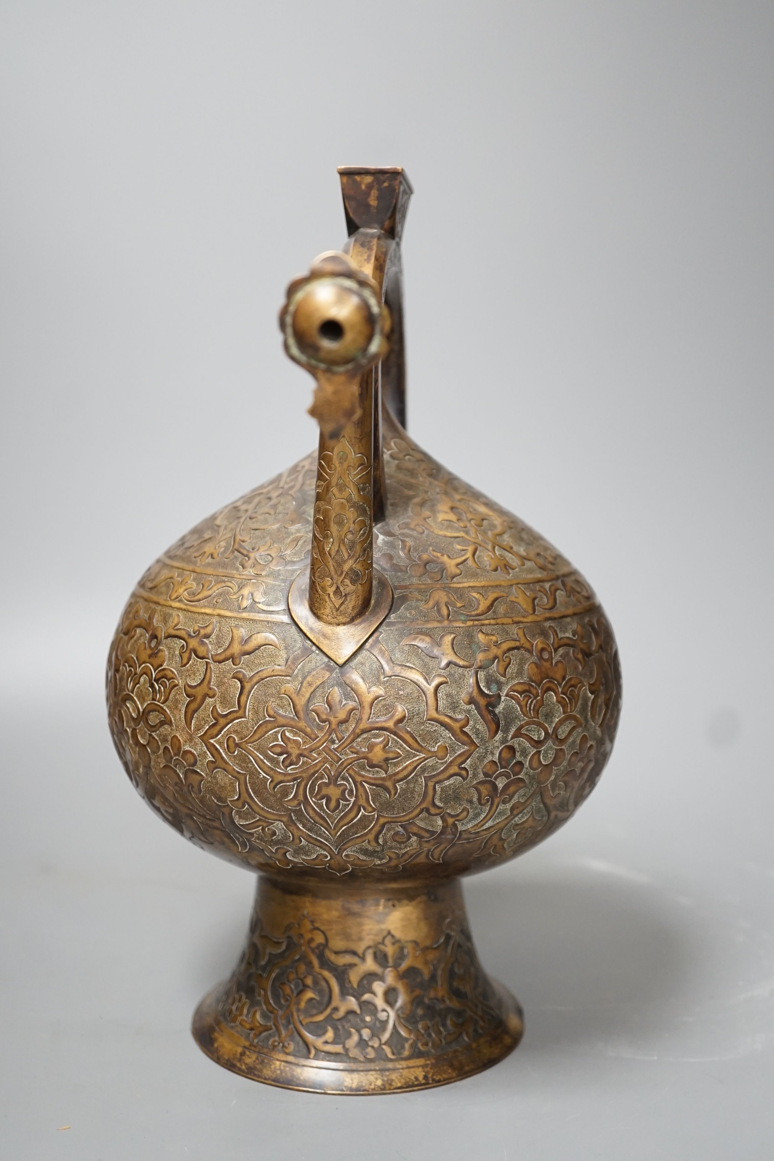 A 19th century Turkish bronze boza ewer - 30cm high